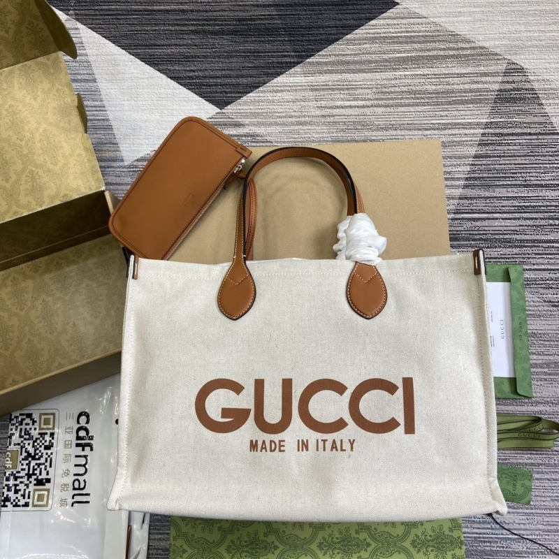 G*u*i shopping bags